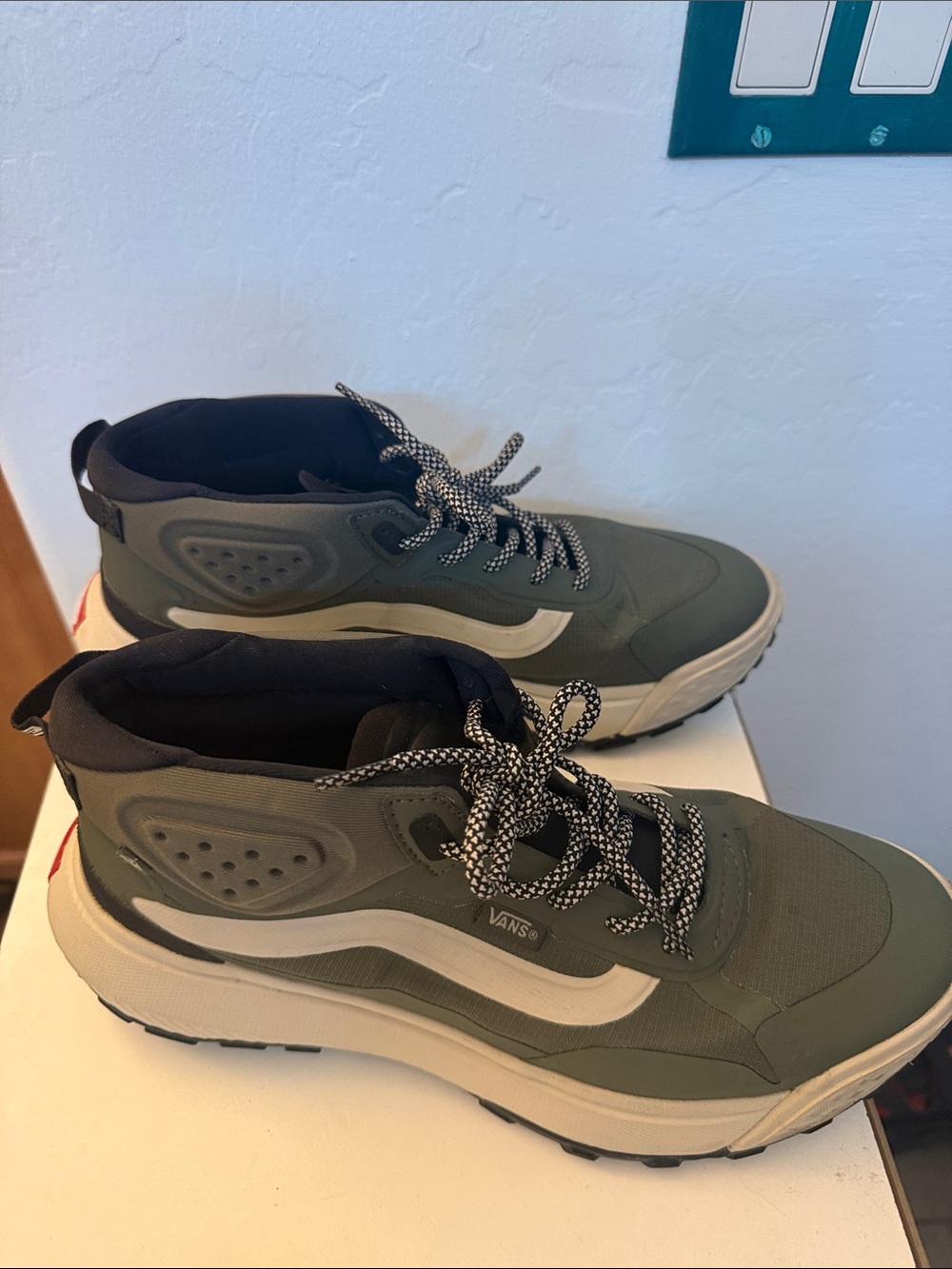 Vans women’s Olive Green High-Top Skate Sneakers with White Stripe